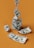 A composition of several one-hundred dollar bills arranged in artistic forms against an orange background. One bill is twisted into a spiral stack reaching upward. Another bill is crumpled into a ball, while a few others are partially unfolded on the surface.