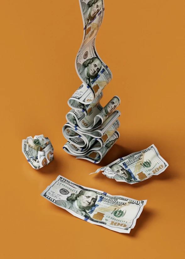 a stack of money sitting on top of a table