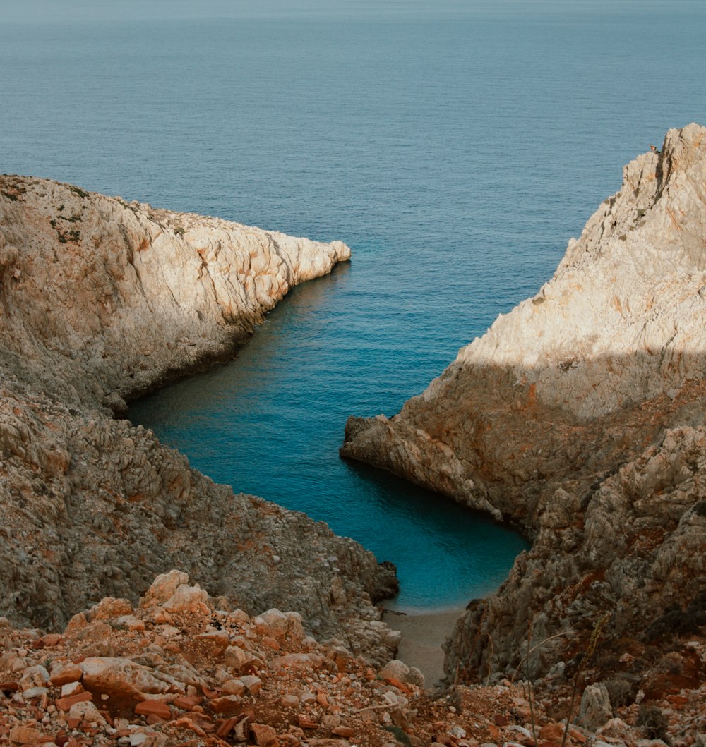 a large body of water surrounded by rocks