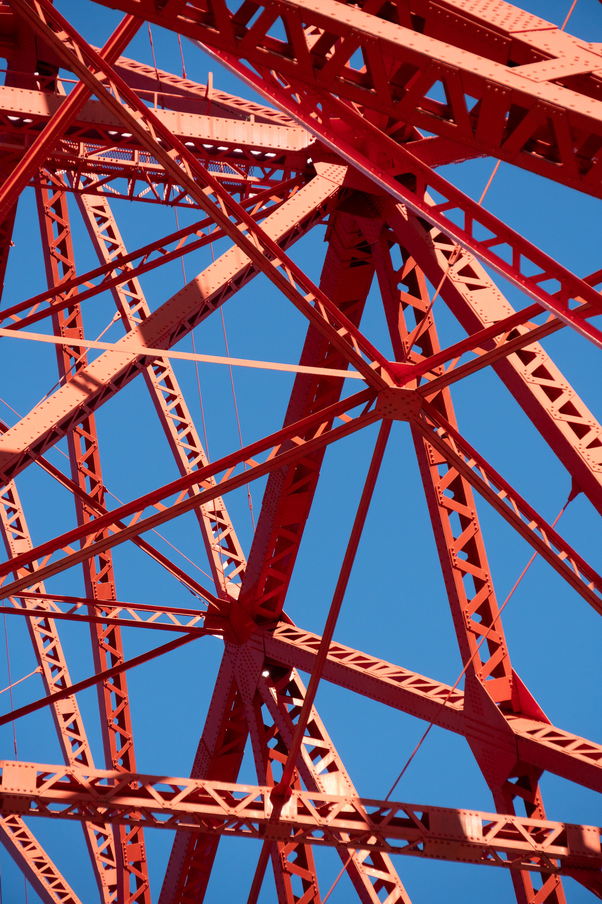 a close up of a metal structure against a blue sky