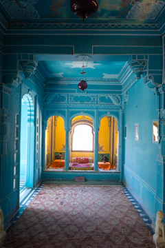 Brightly painted living room wall featuring elegant decorative patterns and smooth finish