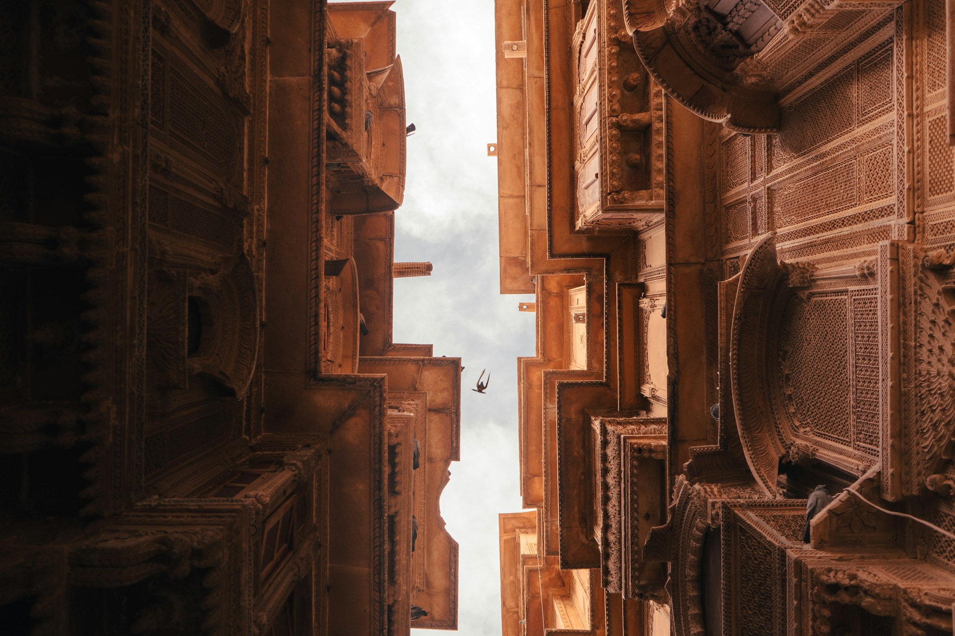 looking up at the architecture of an old city