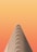 A minimalist architectural structure with a triangular, layered design set against a gradient orange background.
