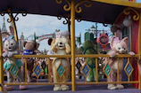 A magical moment of a costumed character posing with excited kids during a birthday celebration.