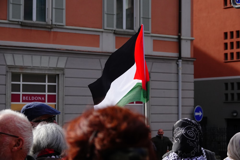 a group of people standing in front of a building