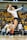 A female volleyball player is captured in mid-air, poised to serve the ball during a match. She is wearing a white jersey and black shorts, with knee pads and white sneakers. The background shows an indoor sports arena filled with spectators seated in yellow seats.