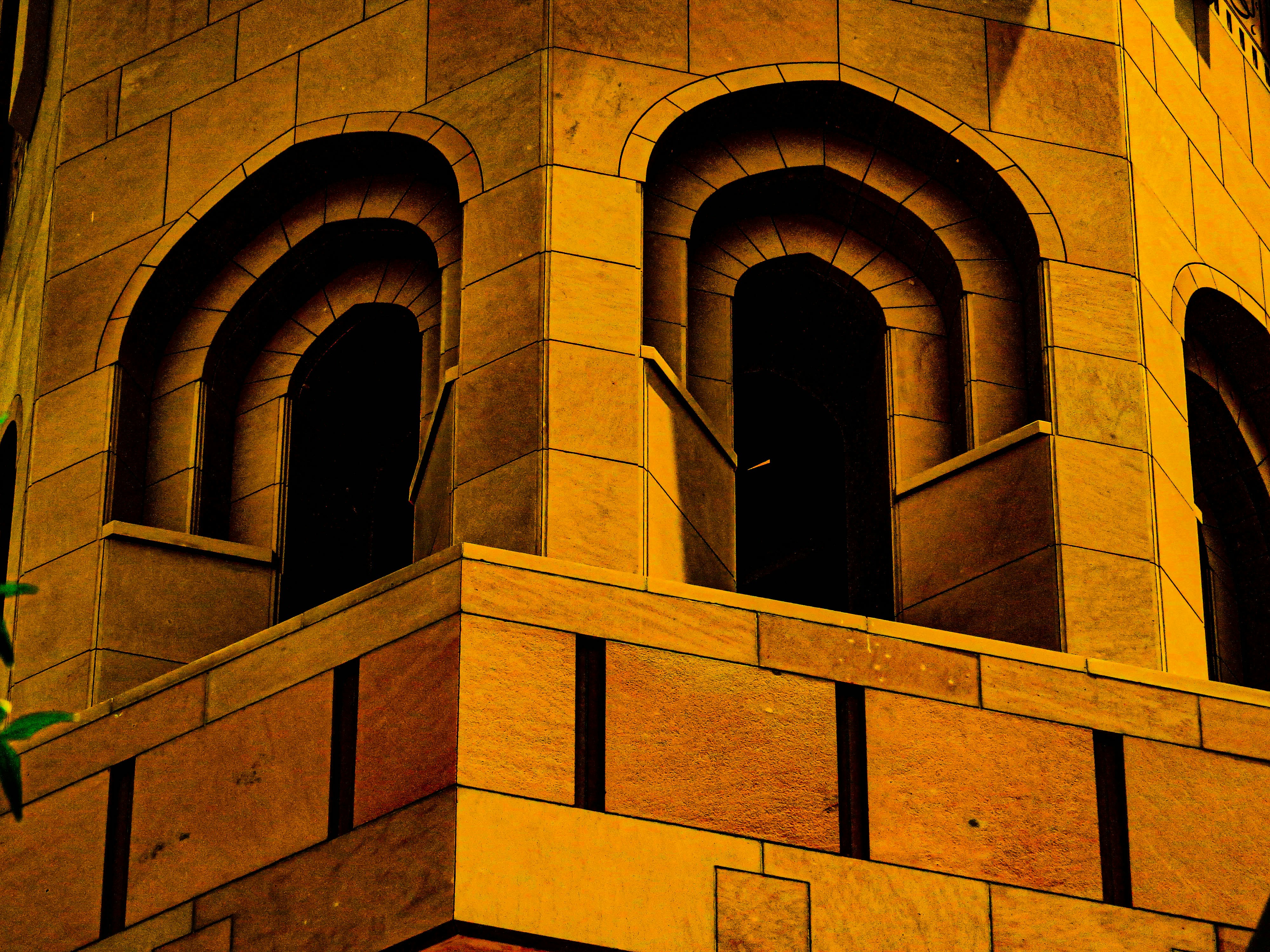 a clock tower with two clocks on each of it's sides