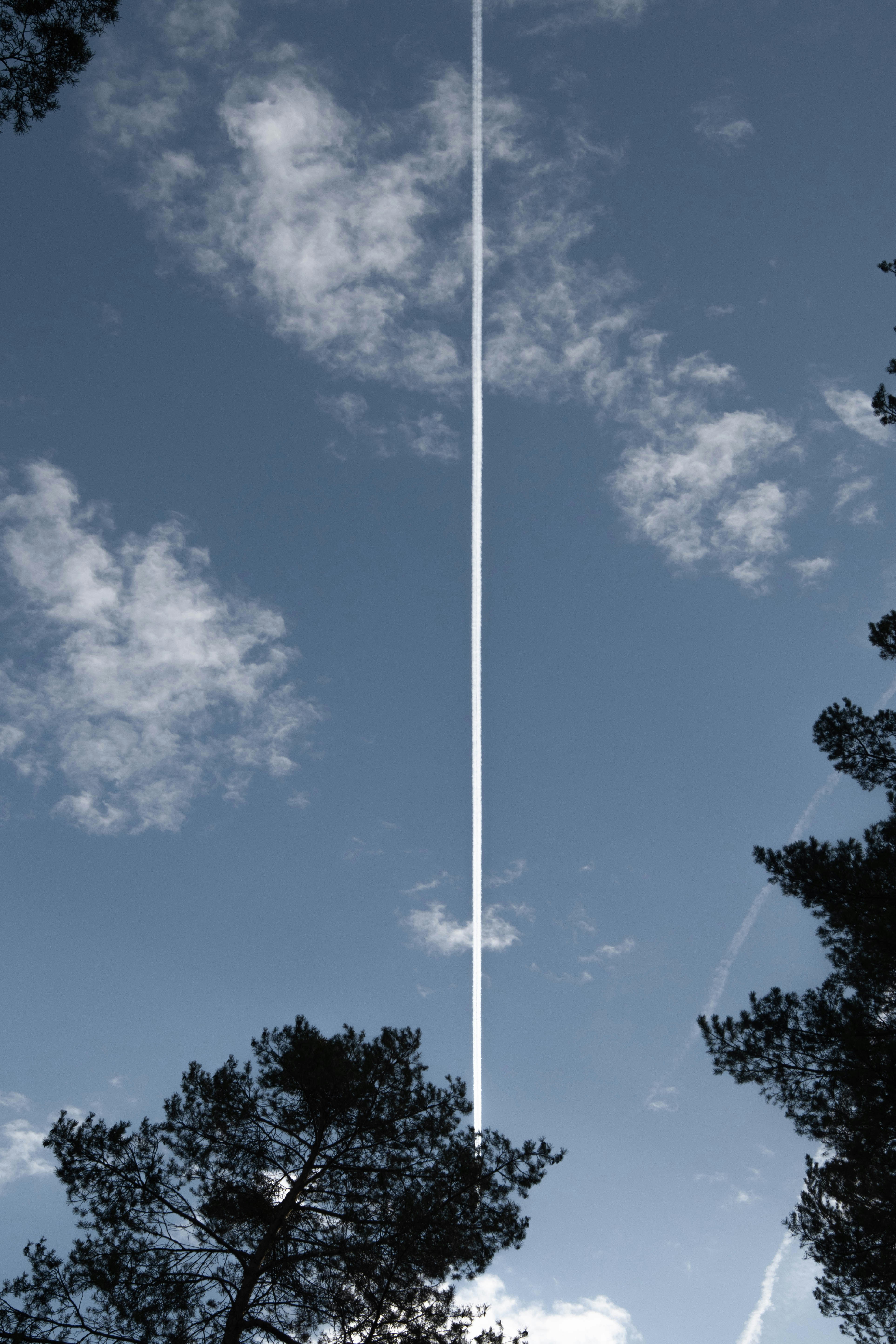 an airplane is flying high in the sky