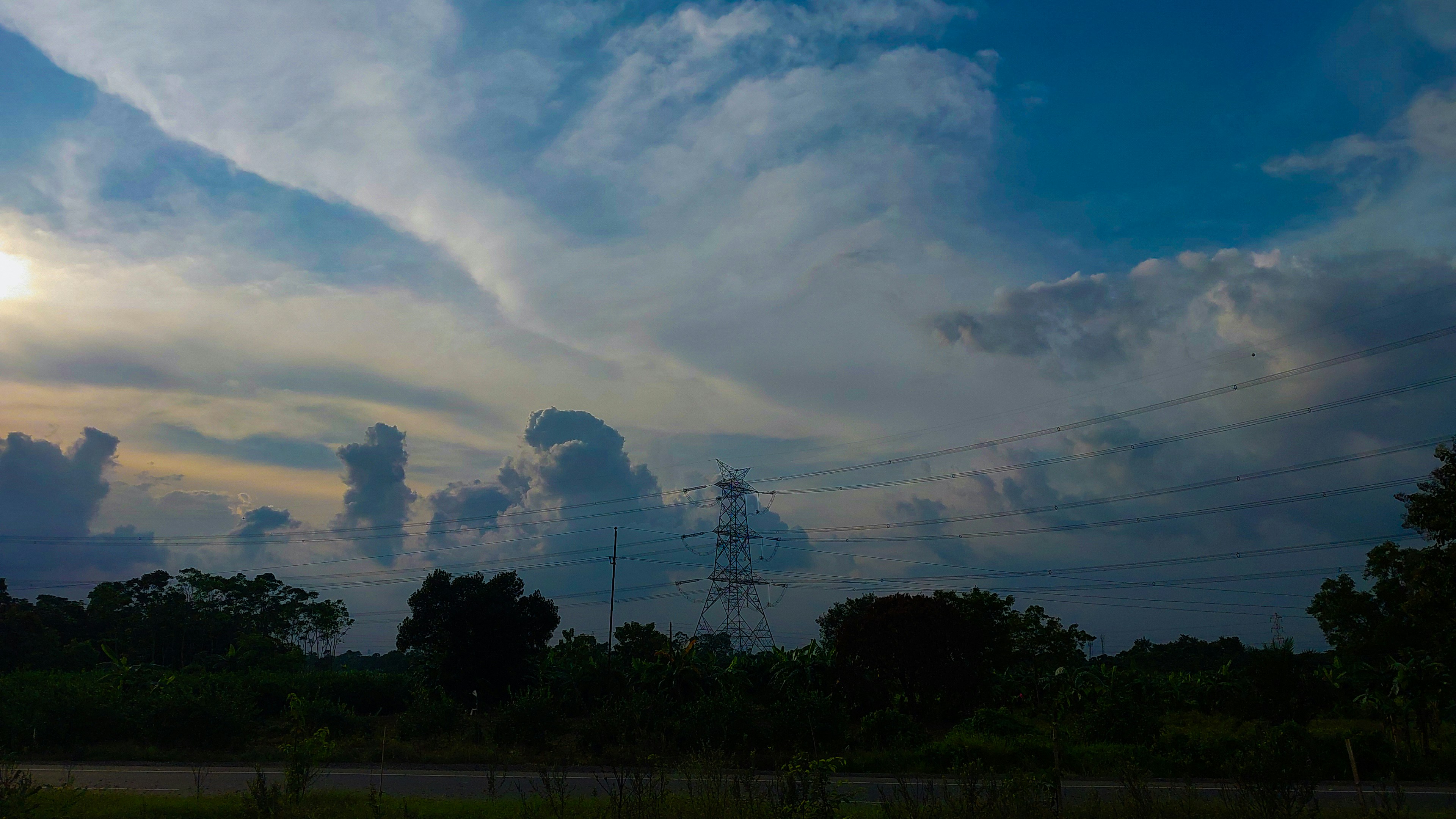 the sun is shining through the clouds in the sky
