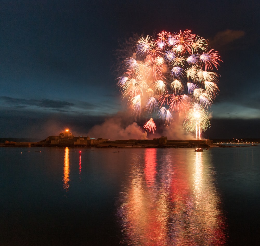 a large fireworks display over a body of water