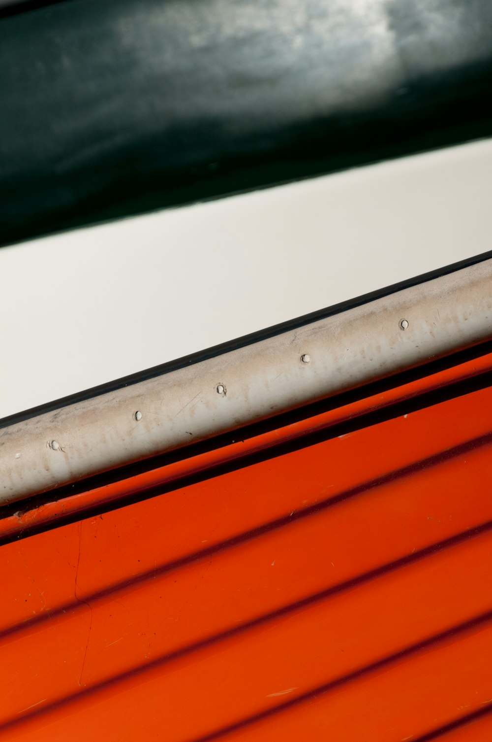 a close up of a red and white boat