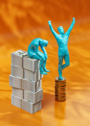 a statue of a man standing on top of stacks of money