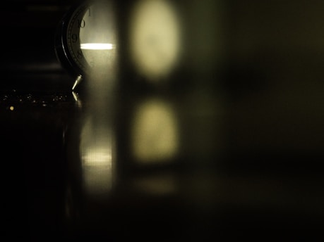 A calm clock face with soft lighting, symbolizing patience and time passing.