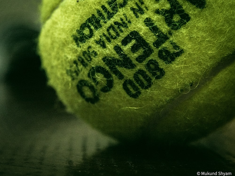 a close up of a tennis ball on a table