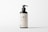 A dark brown bottle with a pump dispenser, featuring a minimalistic label displaying the text 'LBL Cosmetic Label' and additional information. The background is plain and light-colored, creating a clean, modern appearance.