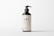 A dark brown bottle with a pump dispenser, featuring a minimalistic label displaying the text 'LBL Cosmetic Label' and additional information. The background is plain and light-colored, creating a clean, modern appearance.
