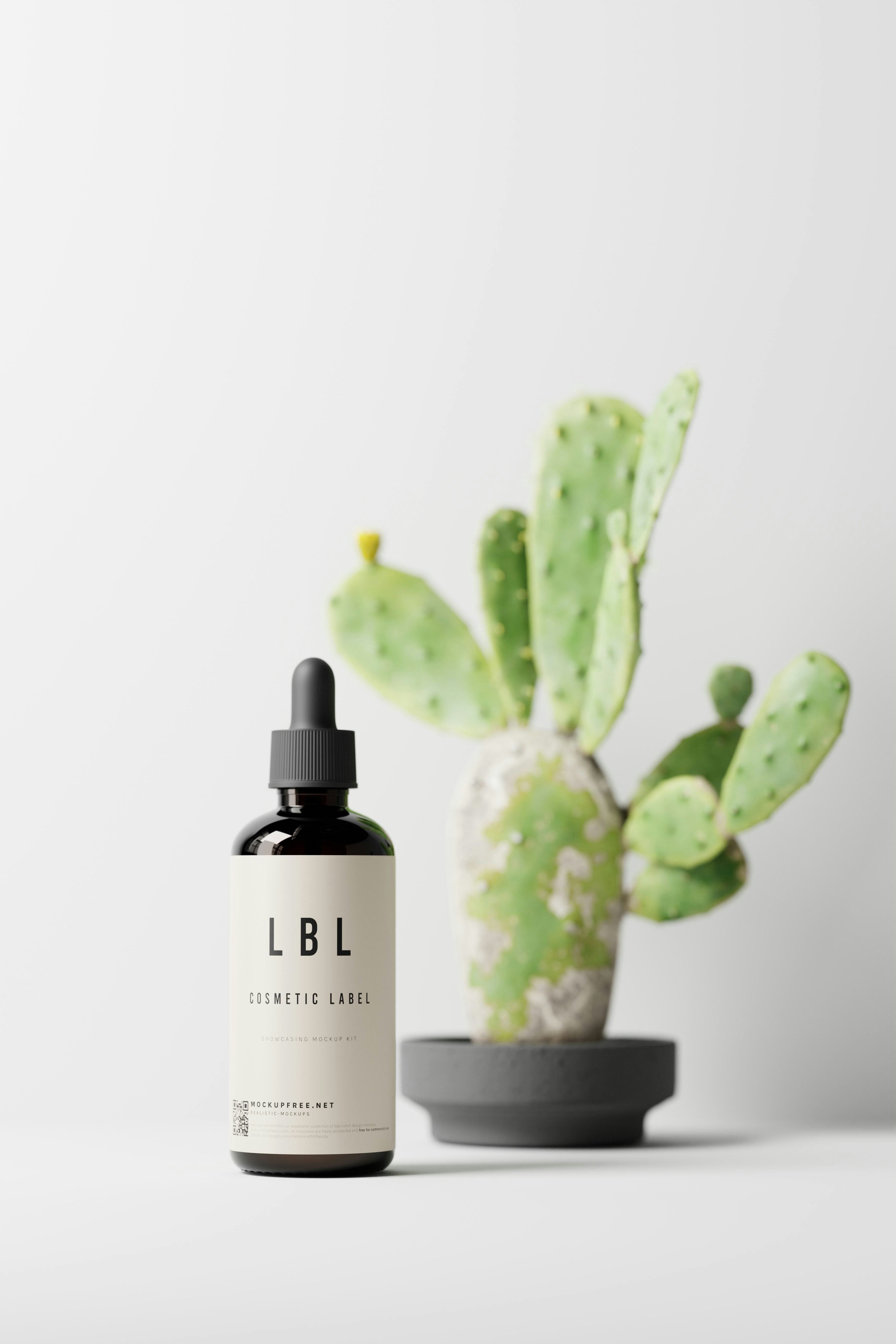 a bottle of liquid next to a cactus