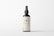 A minimalistic cosmetic bottle with a pump dispenser is positioned centrally against a plain white background. The bottle is dark in color with a simple, elegant label that reads 'LBL COSMETIC LABEL'. The design emphasizes clean lines and simplicity, highlighting the brand's focus on elegance and modern aesthetics.