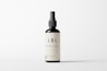 A minimalistic cosmetic bottle with a pump dispenser is positioned centrally against a plain white background. The bottle is dark in color with a simple, elegant label that reads 'LBL COSMETIC LABEL'. The design emphasizes clean lines and simplicity, highlighting the brand's focus on elegance and modern aesthetics.