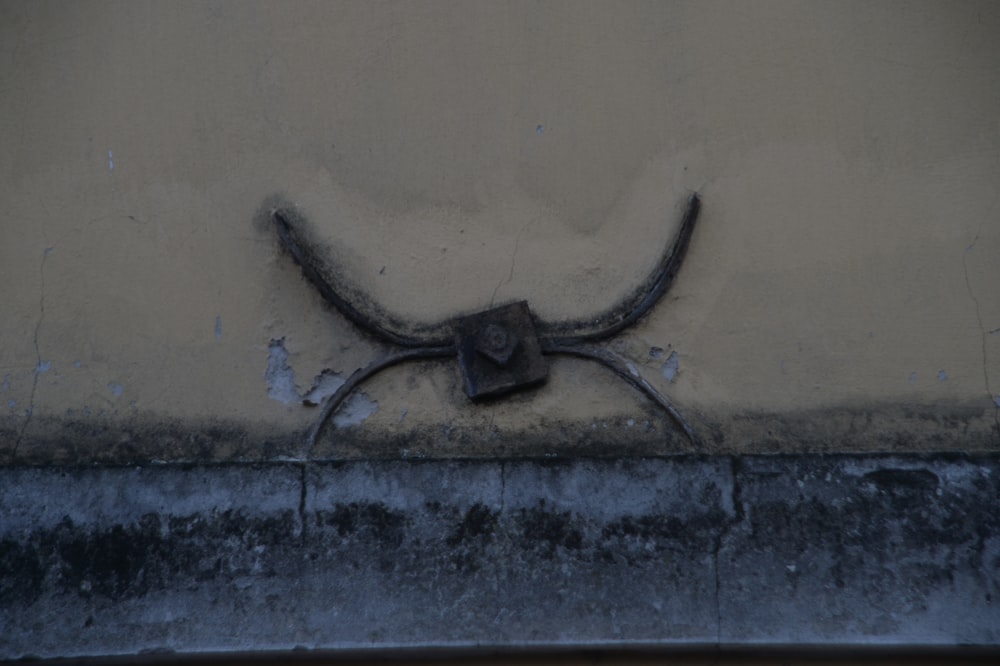 a metal object on the side of a building