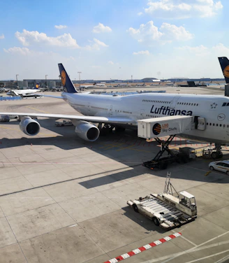 a large jetliner sitting on top of an airport tarmac