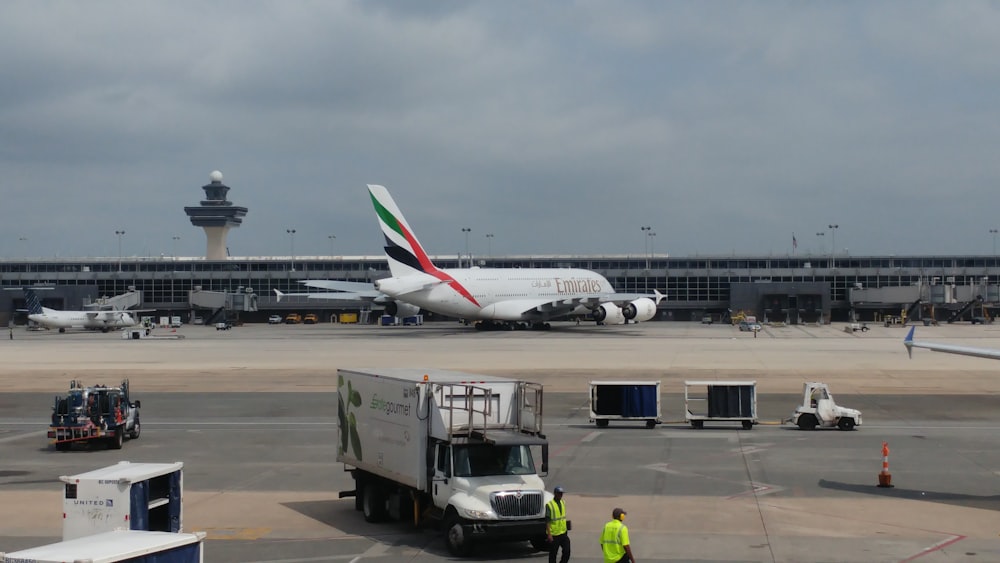 a large jetliner sitting on top of an airport tarmac