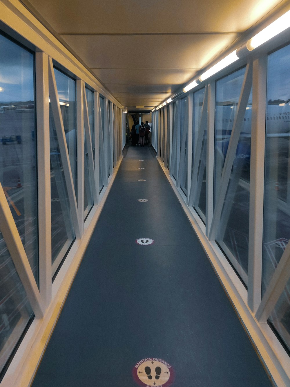 a long hallway with a view of an airport