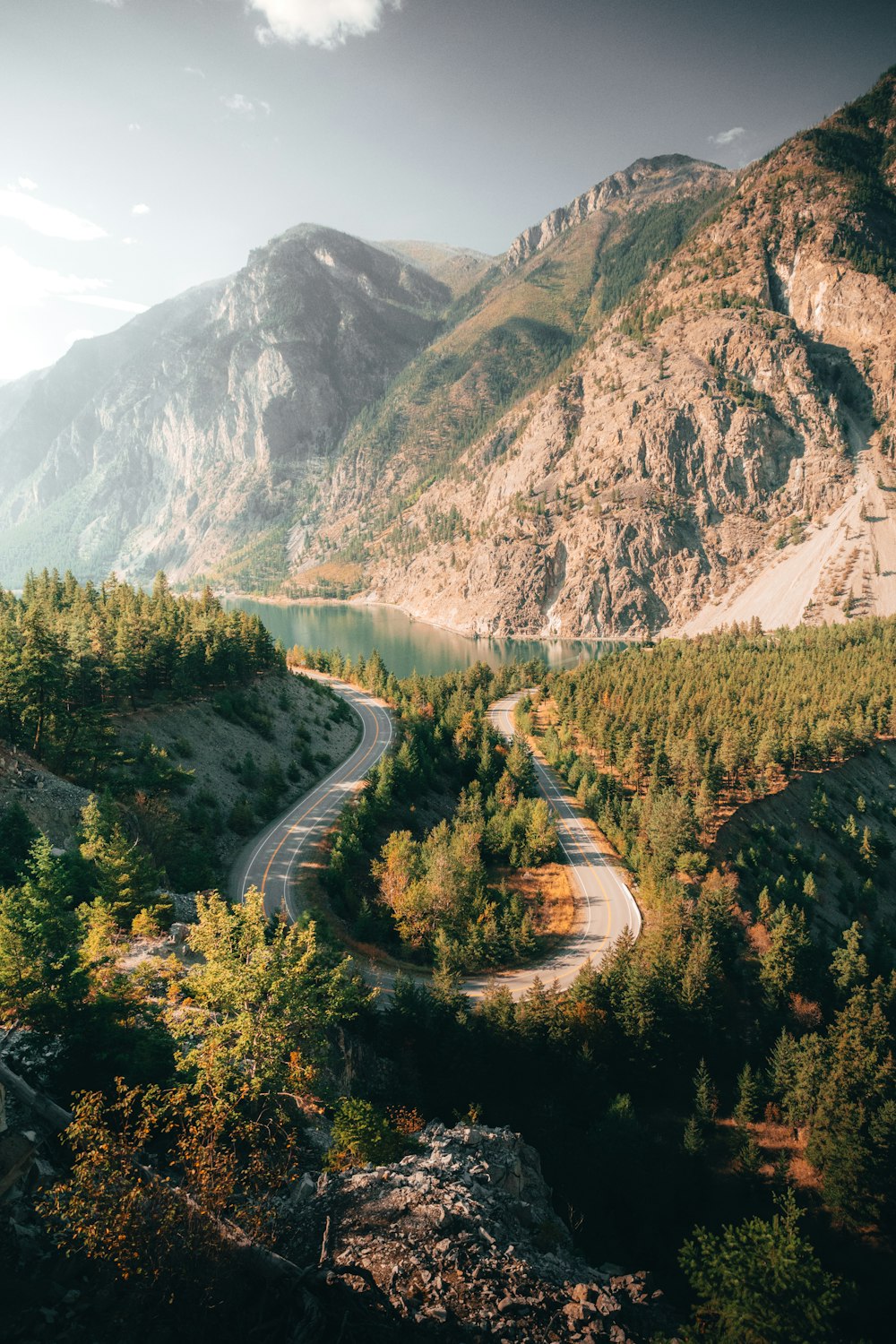 a winding road in the middle of a mountain range