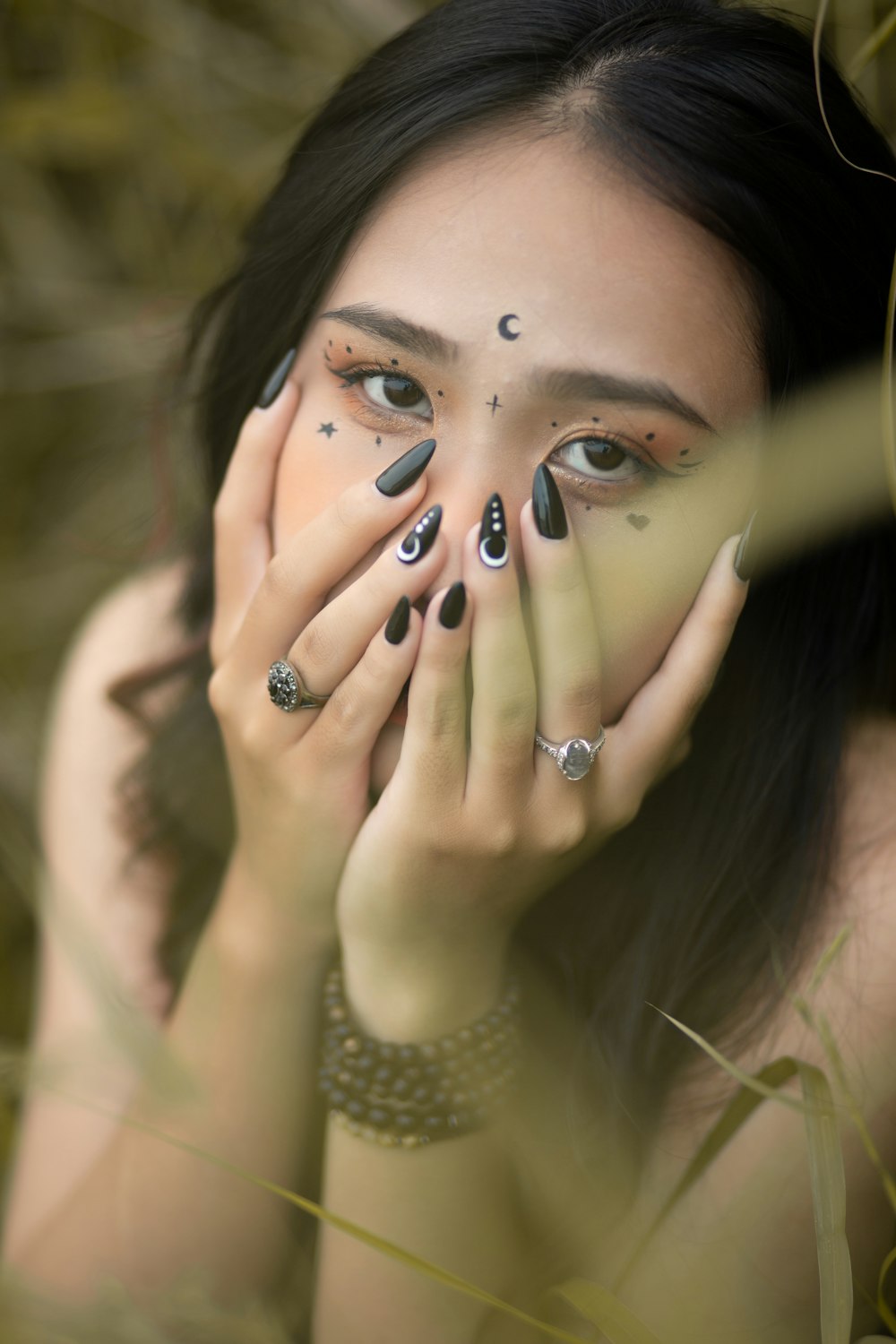 a woman covering her face with her hands