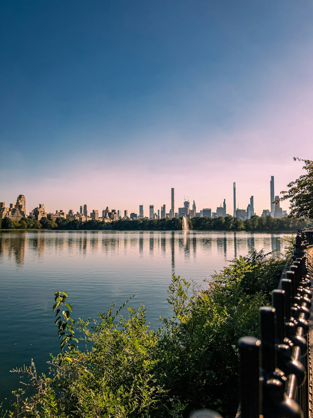 a body of water with a city in the background