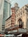 A vibrant cityscape features the iconic Chicago Theatre with its bright red and gold marquee sign. Surrounding the theater are tall modern and historic buildings, showcasing a blend of architectural styles. People gather below among colorful umbrellas, suggesting a lively urban atmosphere.