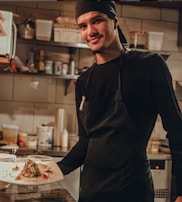 A chef preparing a classic Syrian meal in a modern kitchen.