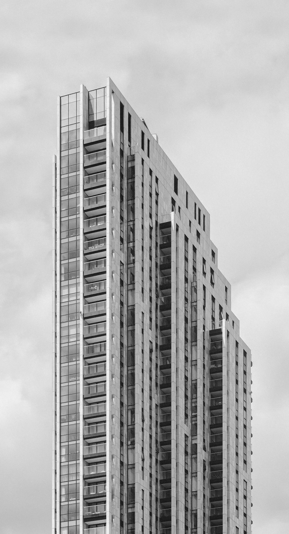 a black and white photo of a tall building