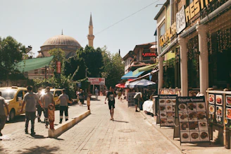 A vibrant street scene in Cairo showing historic buildings alongside bustling modern life.