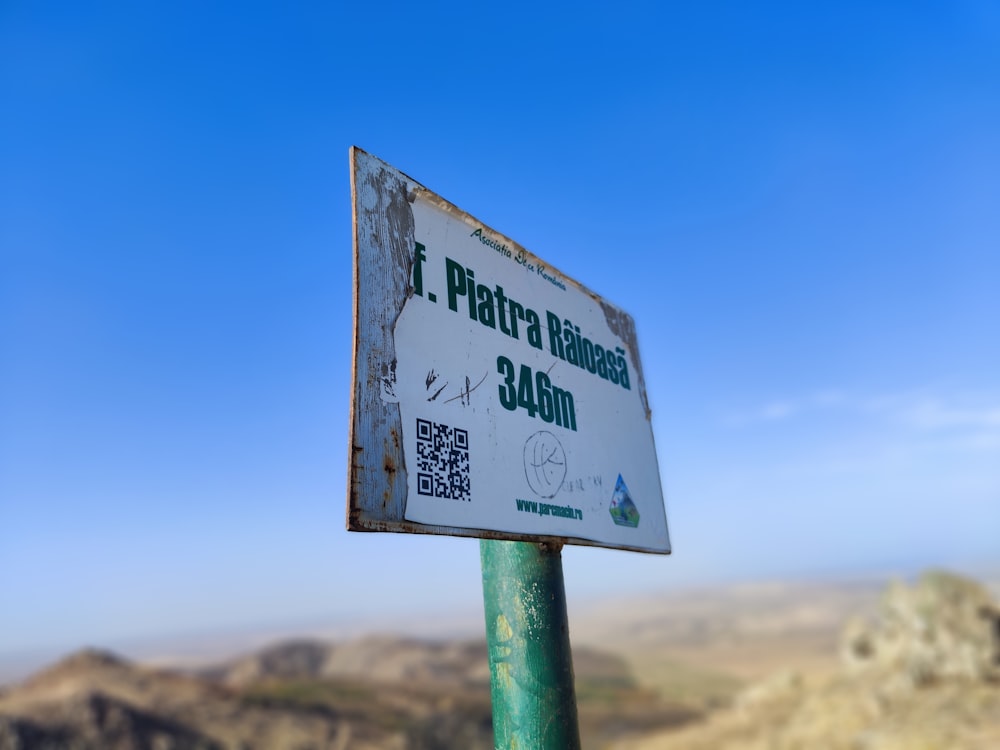 a sign that is on top of a pole