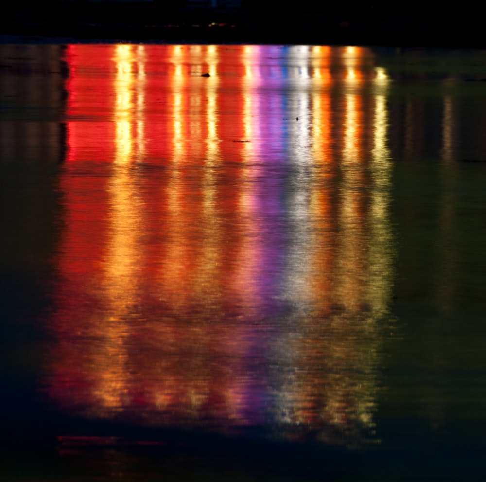 a large body of water filled with lots of colorful lights