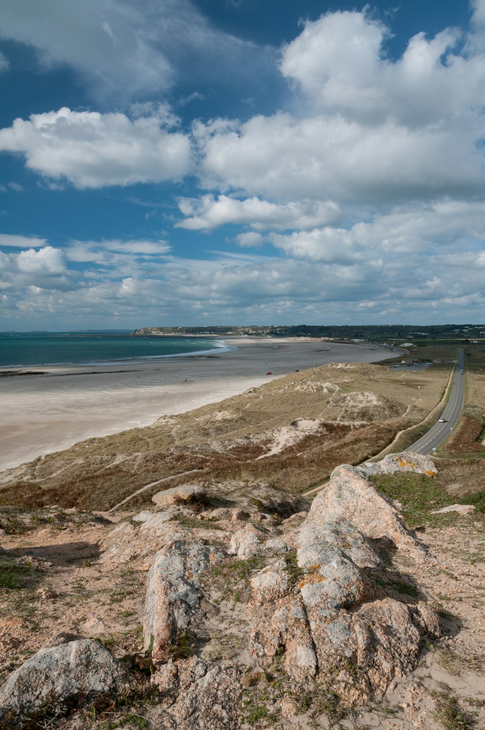 a view of a beach from a hill