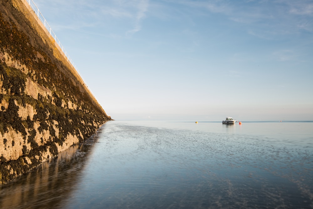 a boat floating on top of a body of water