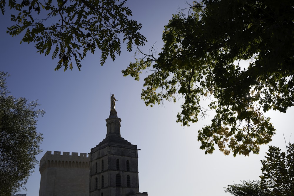 a tall tower with a clock on the top of it