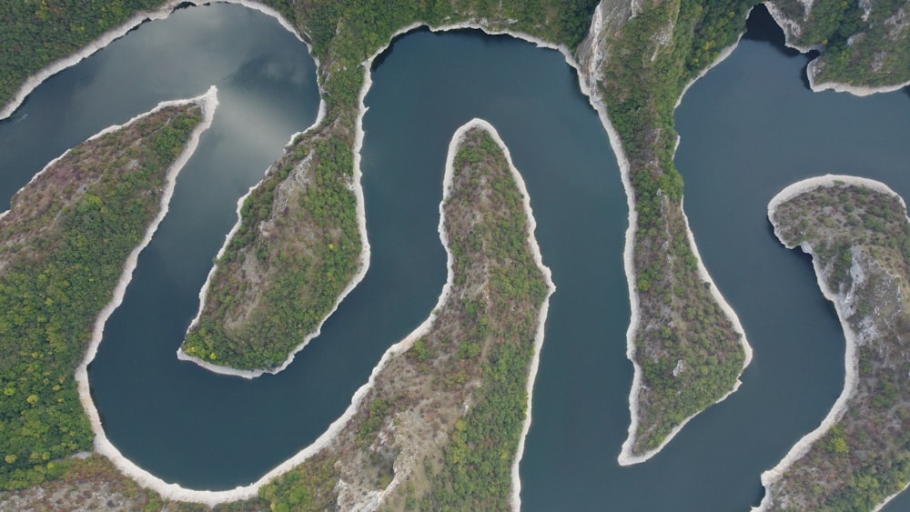 an aerial view of a body of water surrounded by land