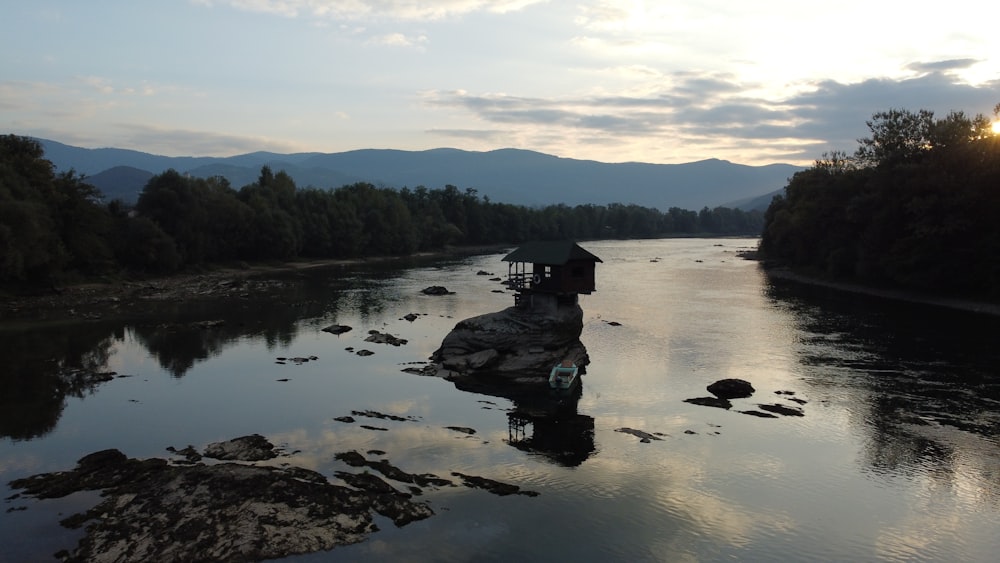 a body of water surrounded by trees and rocks