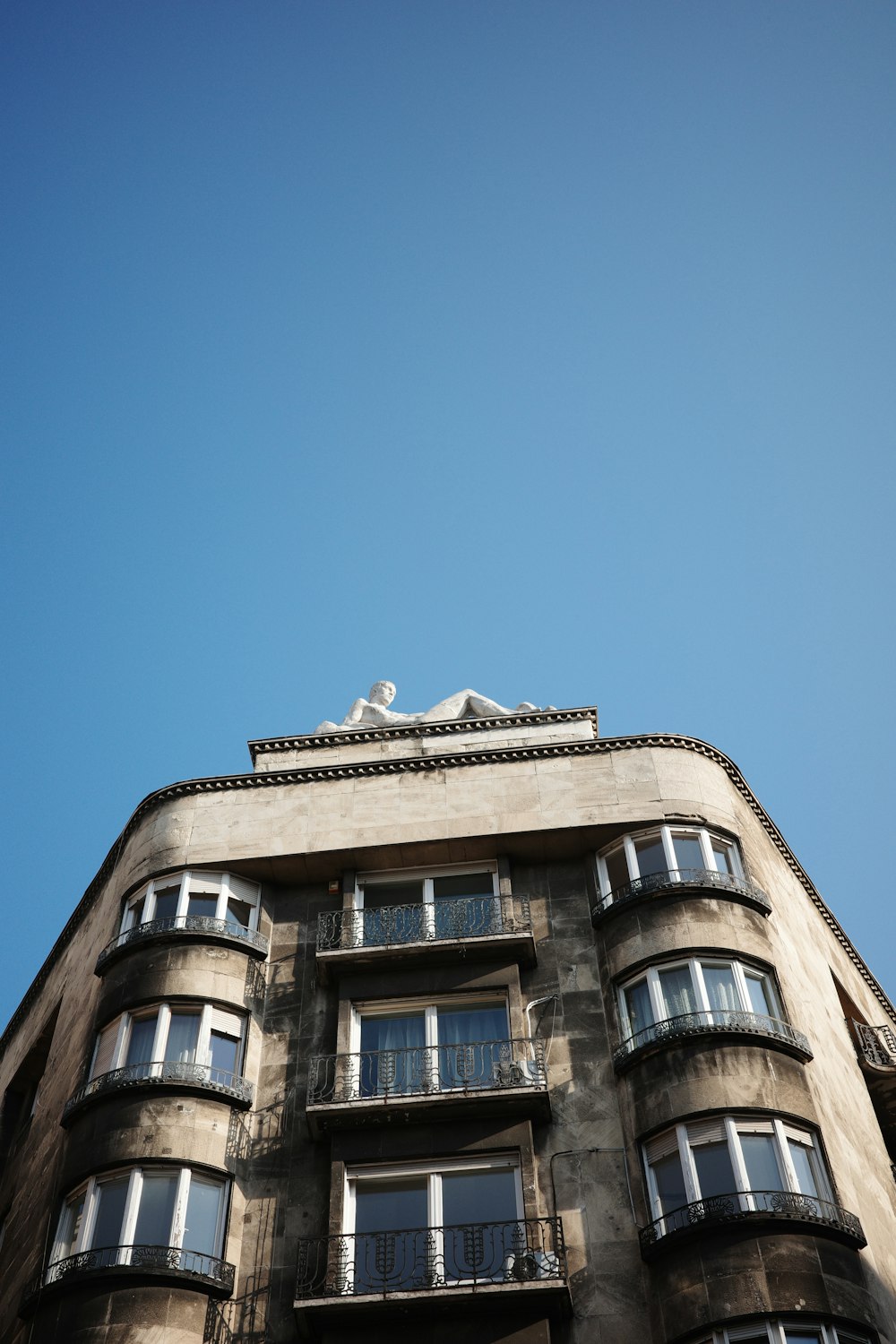 a tall building with balconies and balconies on top