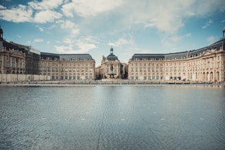 a large building with a large body of water in front of it