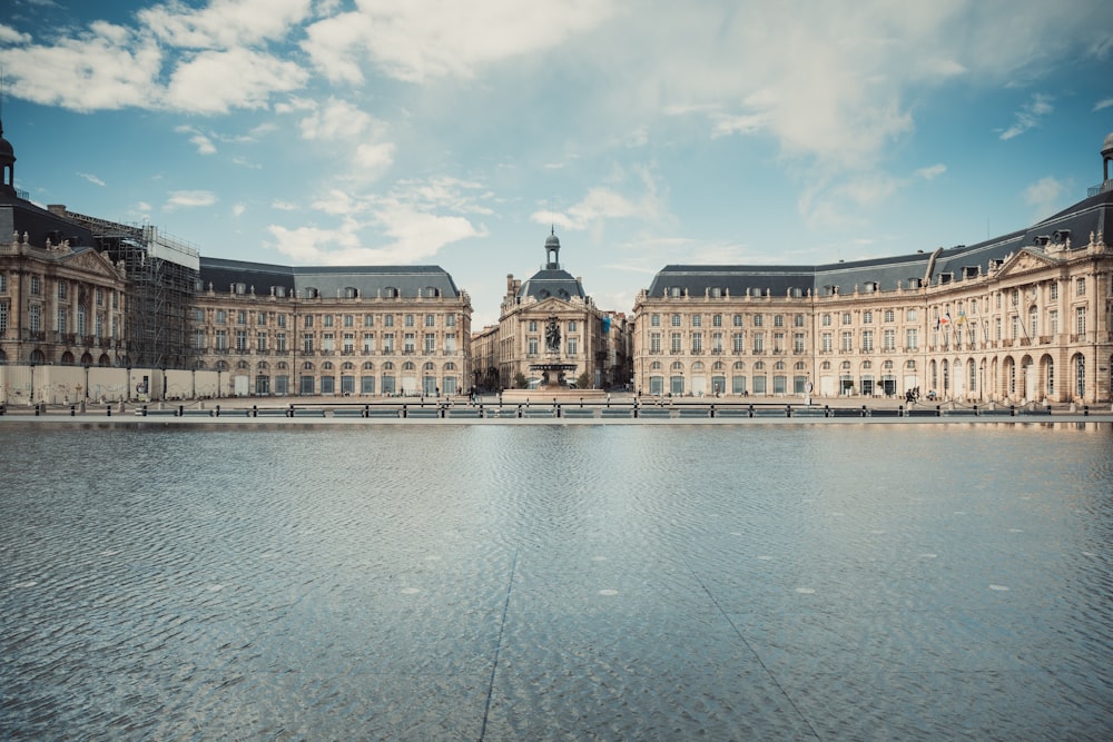 a large building with a large body of water in front of it