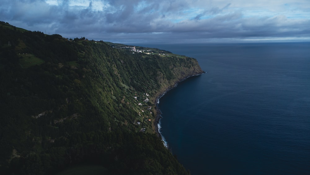 an aerial view of a cliff overlooking the ocean