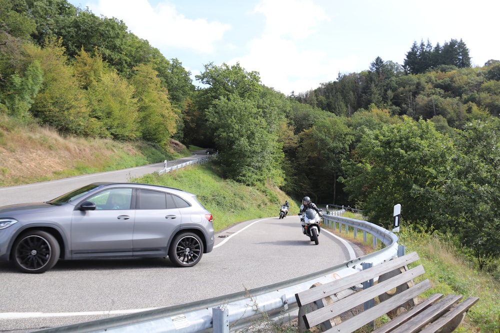 a person riding a motorcycle on a winding road