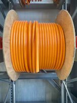 Large spools of power cables ready for shipment at the factory.