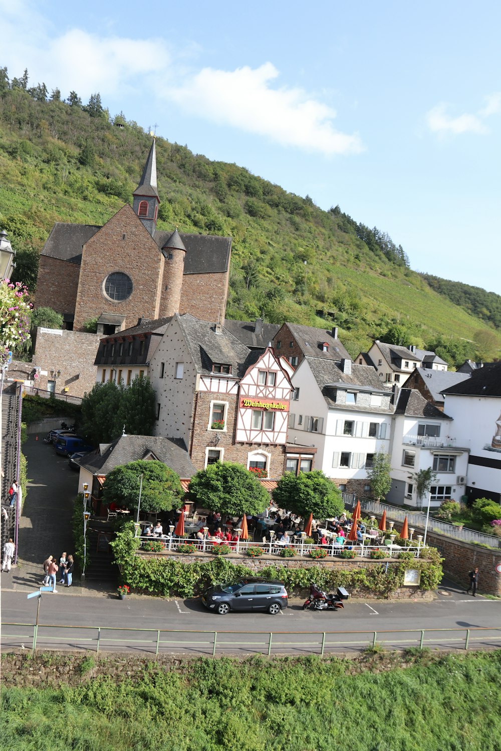 a small town with a church on the top of a hill