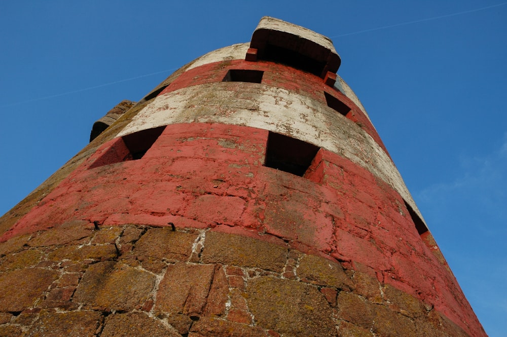 a tall brick tower with a blue sky in the background