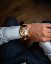a person wearing a watch on their wrist